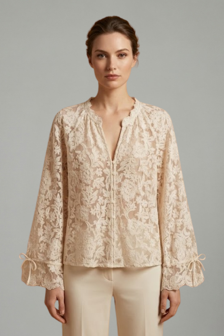Women’s sheer lace blouse with floral texture, V-neckline button closure, and long flared sleeves for elegant everyday styling.