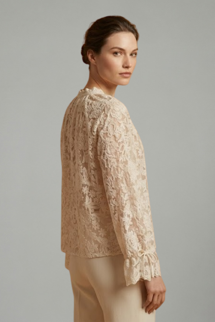 Women’s sheer lace blouse with floral texture, V-neckline button closure, and long flared sleeves for elegant everyday styling.