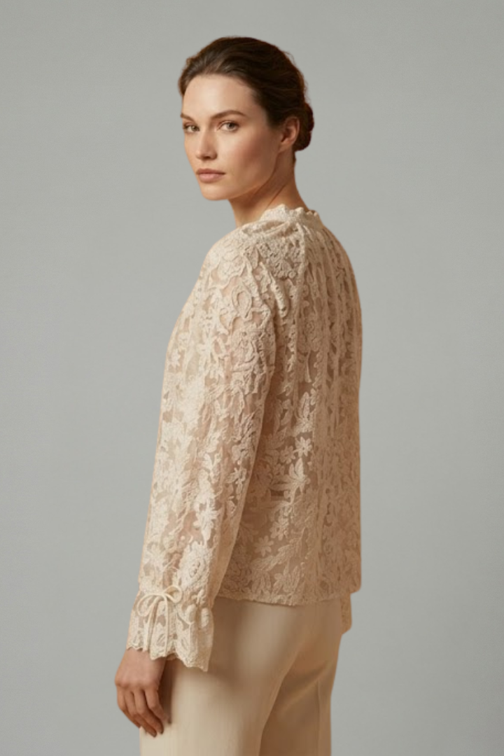 Women’s sheer lace blouse with floral texture, V-neckline button closure, and long flared sleeves for elegant everyday styling.