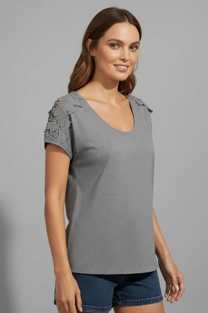 Women’s T-shirt with round neckline and lace shoulder trim, designed for everyday wear and casual outfits.