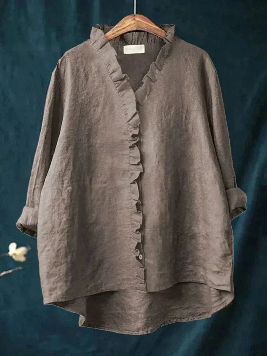 Women’s linen blouse with ruffle neckline and relaxed fit, suitable for summer wear, office outfits, and casual occasions.