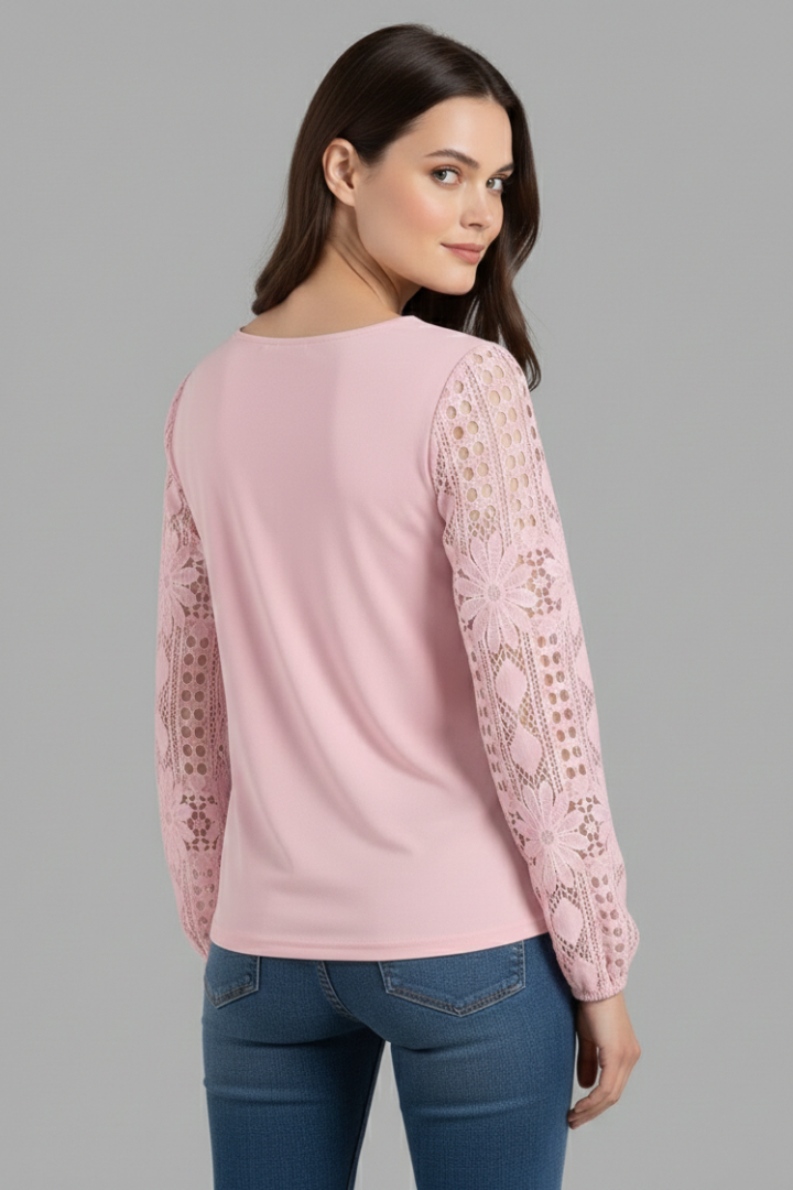 Women’s long sleeve blouse with lace sleeves and cut out detailing, featuring a round neckline and straight hem for office or evening wear.