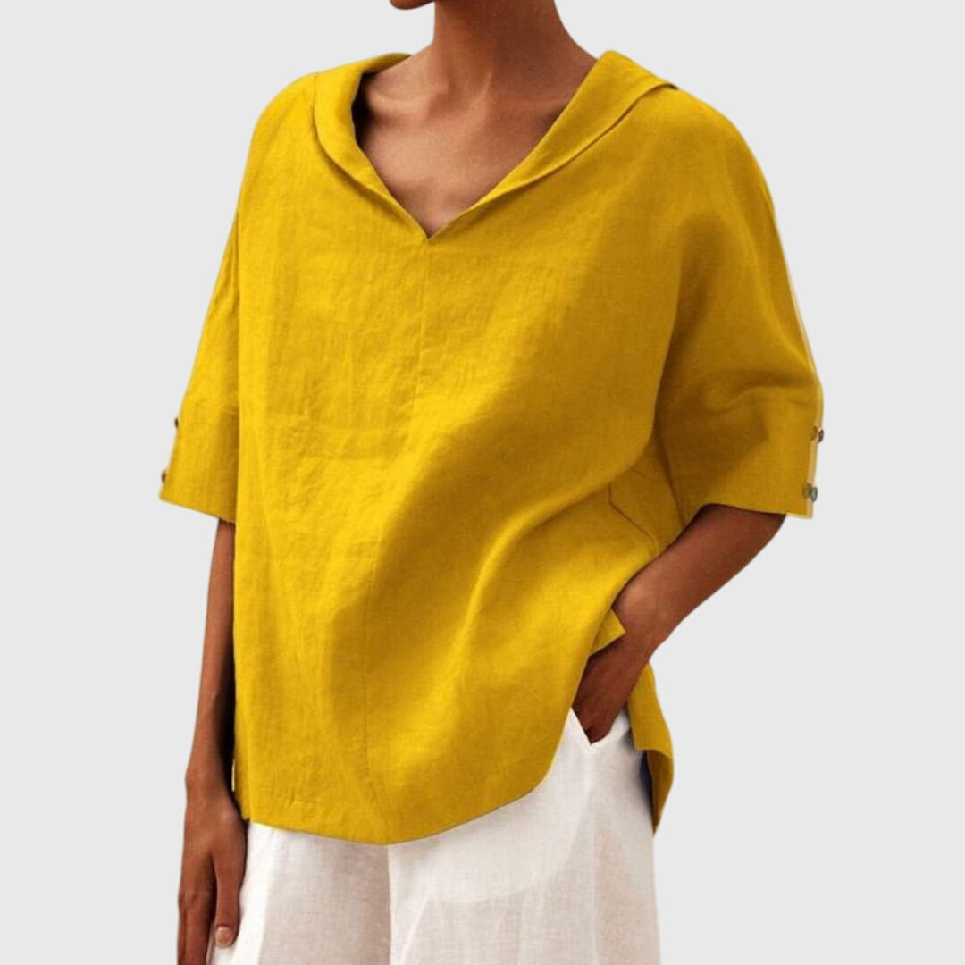 Women’s loose-fit blouse with a relaxed silhouette and versatile design, suitable for casual outfits, office wear, and everyday styling.