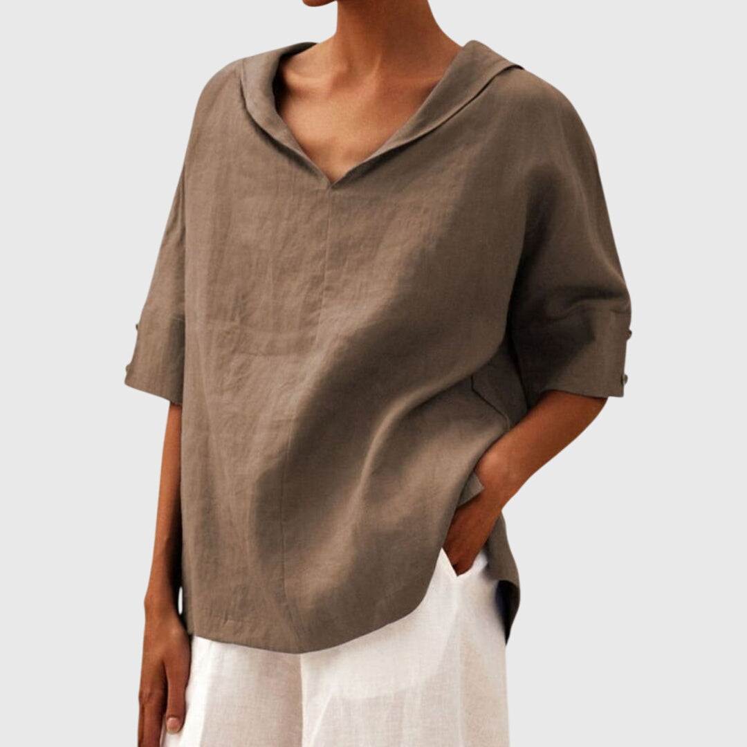 Women’s loose-fit blouse with a relaxed silhouette and versatile design, suitable for casual outfits, office wear, and everyday styling.