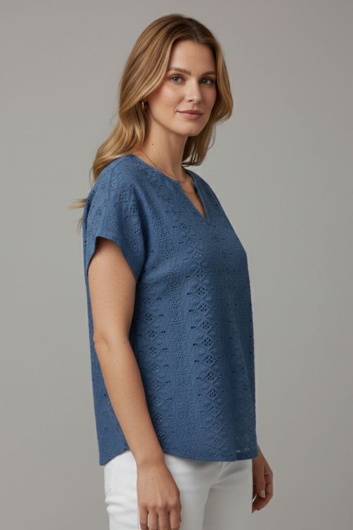 Women’s T-shirt with notched neckline and eyelet surface detailing, designed for casual wear and everyday outfits.