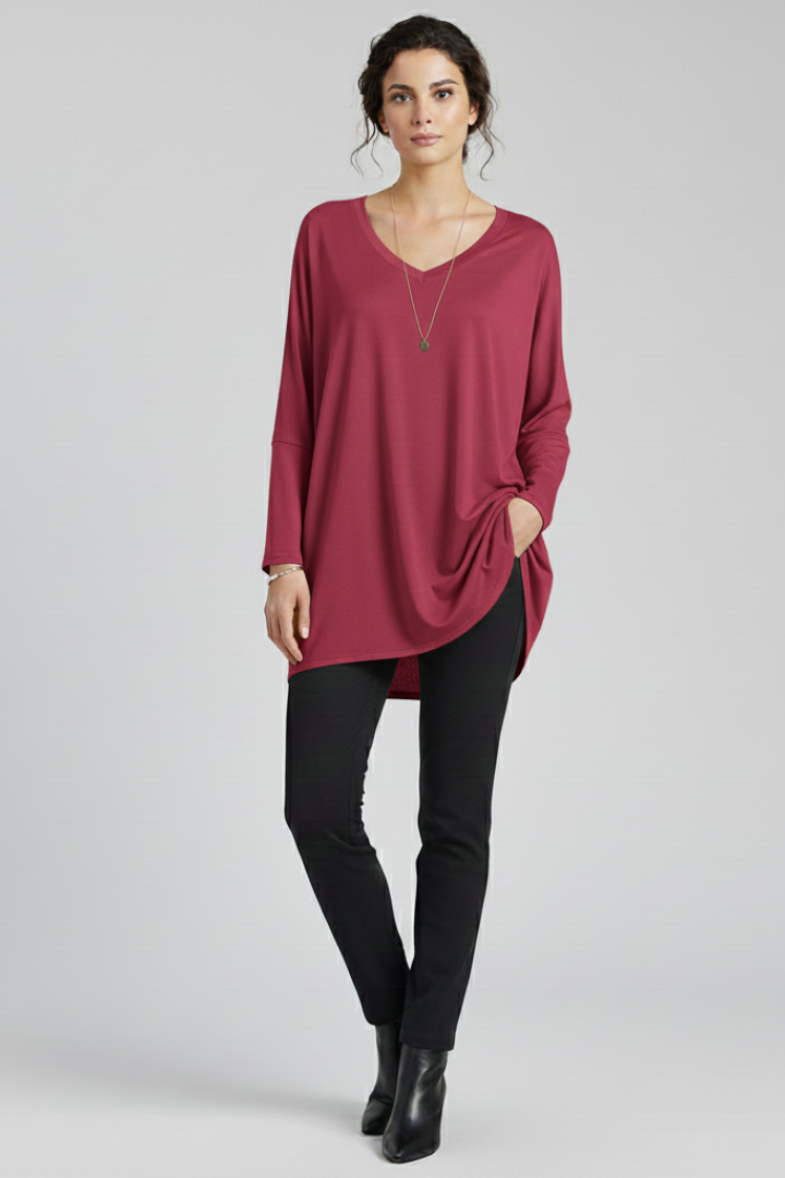 Women’s oversized V-neck shirt with long sleeves, designed for casual wear and versatile everyday outfits