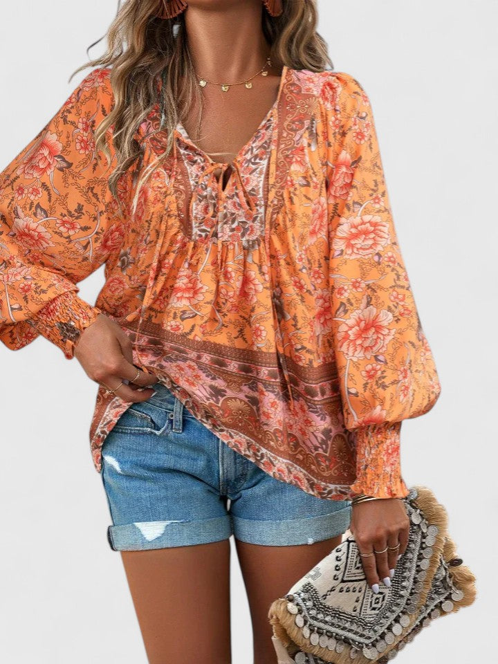 Women’s peasant top with floral print, long sleeves, and relaxed fit, suitable for casual outings, vacations, and everyday styling.