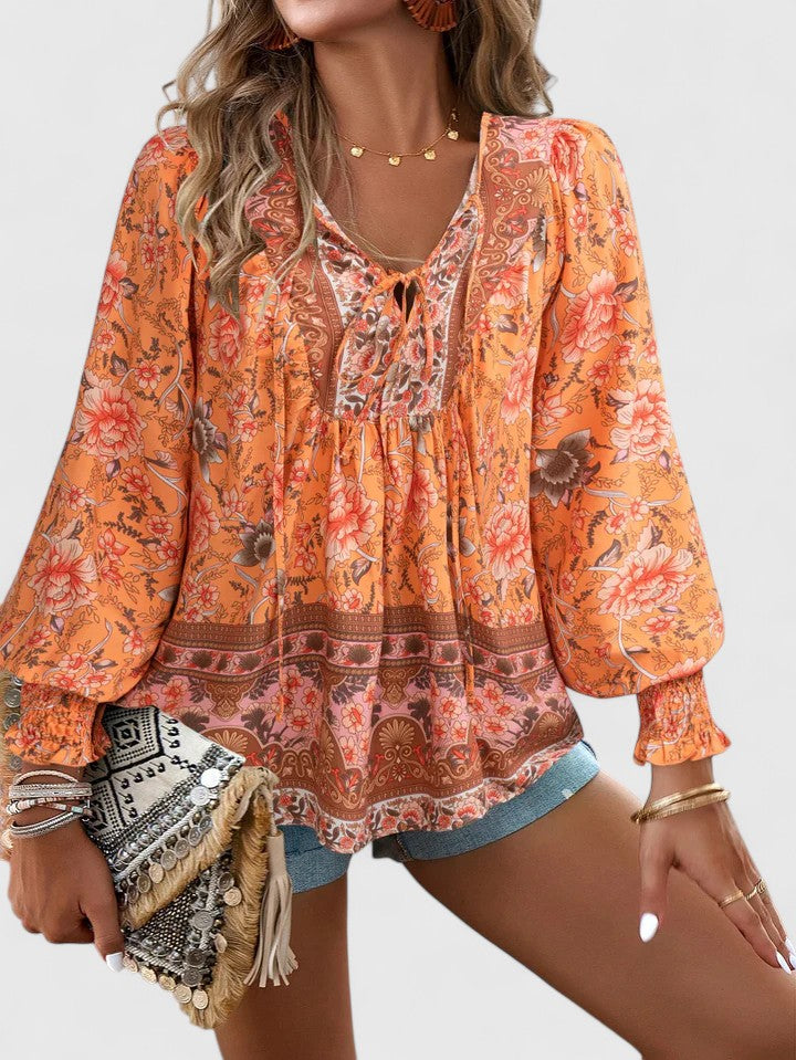 Women’s peasant top with floral print, long sleeves, and relaxed fit, suitable for casual outings, vacations, and everyday styling.