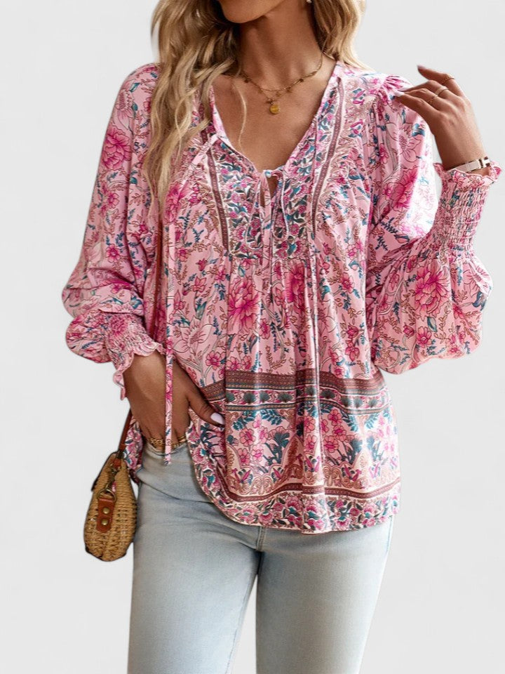 Women’s peasant top with floral print, long sleeves, and relaxed fit, suitable for casual outings, vacations, and everyday styling.