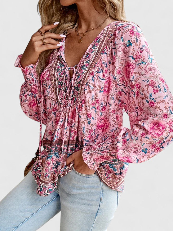 Women’s peasant top with floral print, long sleeves, and relaxed fit, suitable for casual outings, vacations, and everyday styling.