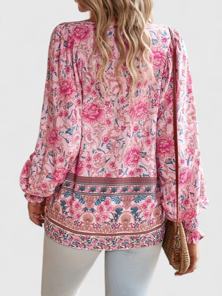 Women’s peasant top with floral print, long sleeves, and relaxed fit, suitable for casual outings, vacations, and everyday styling.