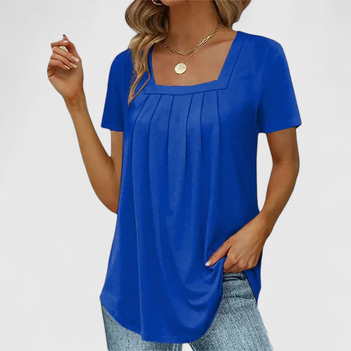 Women’s pleated blouse with a square neckline and relaxed fit, ideal for summer outfits, office wear, and smart casual occasions.