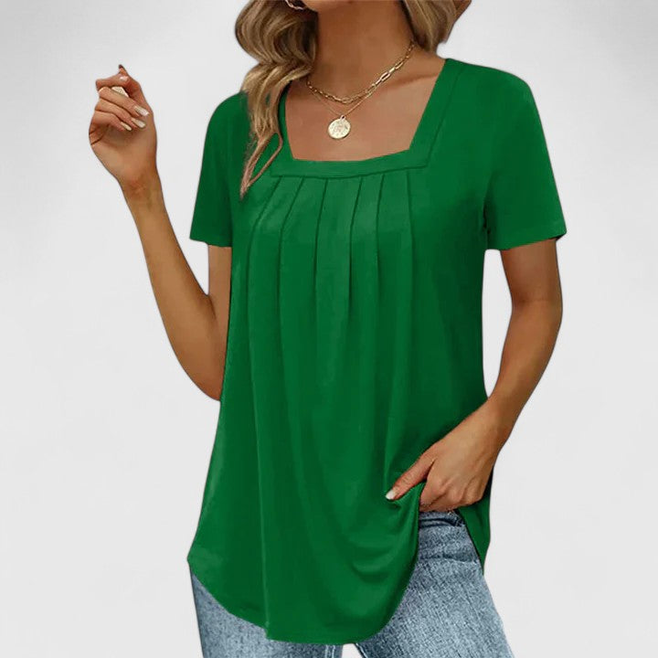 Women’s pleated blouse with a square neckline and relaxed fit, ideal for summer outfits, office wear, and smart casual occasions.
