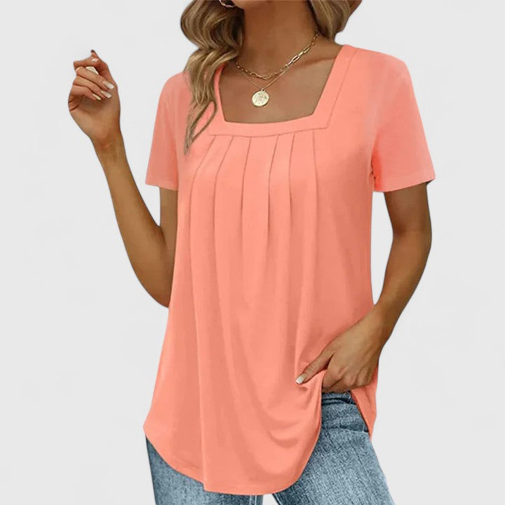 Women’s pleated blouse with a square neckline and relaxed fit, ideal for summer outfits, office wear, and smart casual occasions.