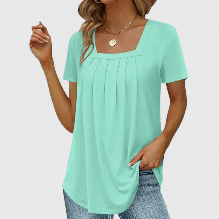 Women’s pleated blouse with a square neckline and relaxed fit, ideal for summer outfits, office wear, and smart casual occasions.