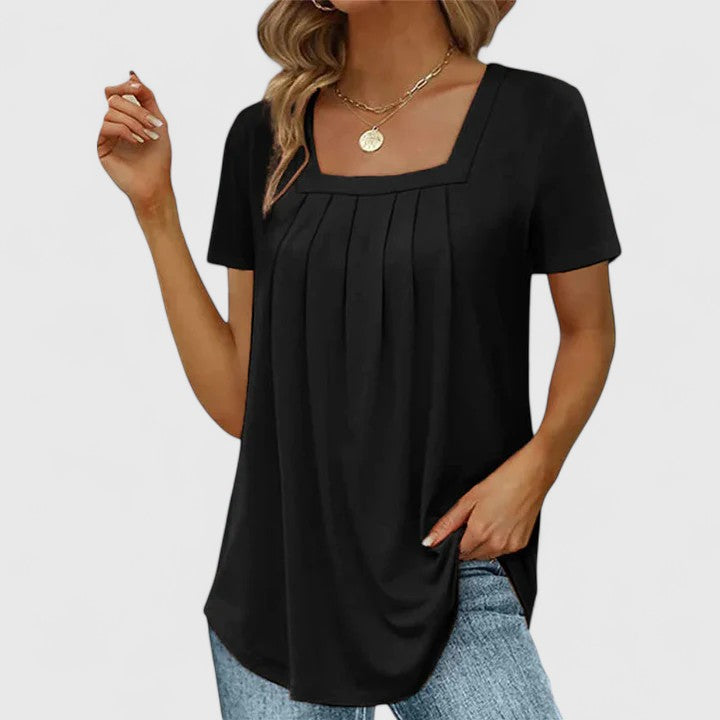 Women’s pleated blouse with a square neckline and relaxed fit, ideal for summer outfits, office wear, and smart casual occasions.