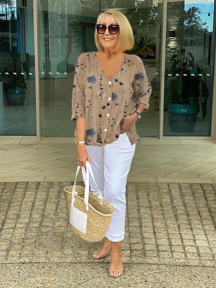 Women’s plus size floral blouse with a v-neck and relaxed fit, suitable for office outfits, casual wear, and everyday styling.