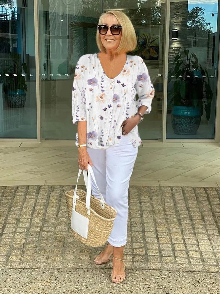 Women’s plus size floral blouse with a v-neck and relaxed fit, suitable for office outfits, casual wear, and everyday styling.