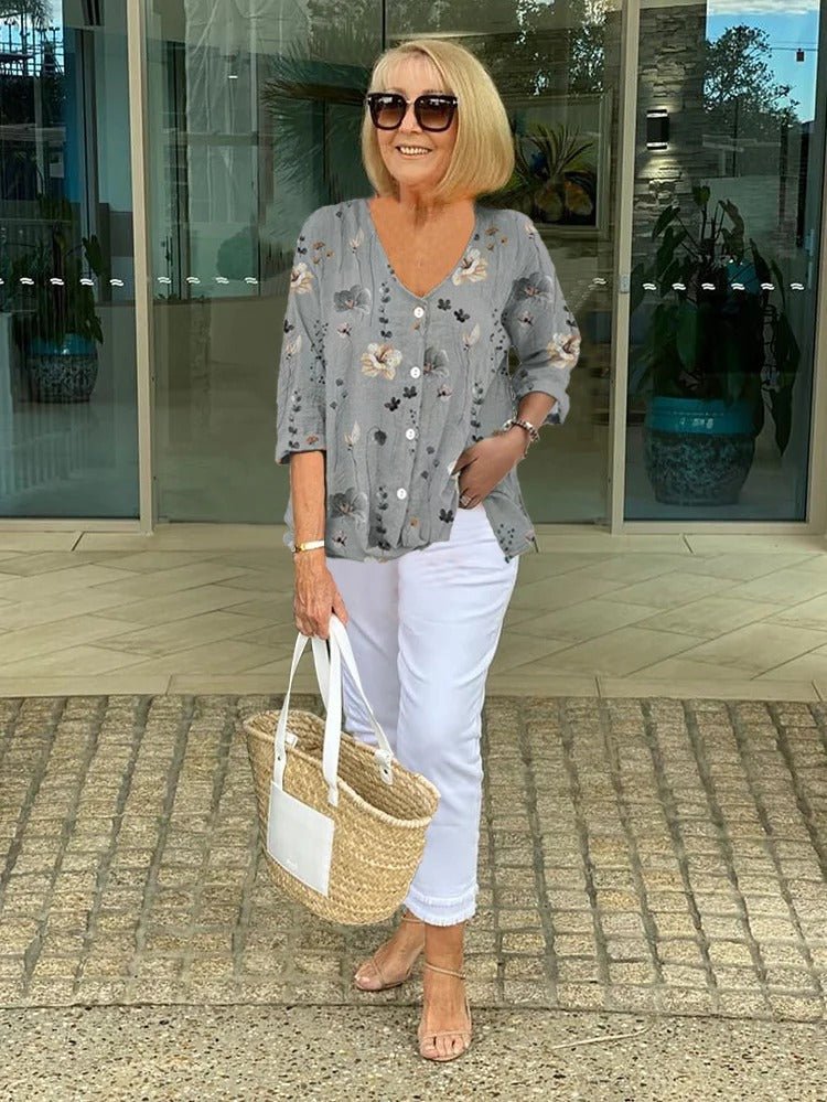 Women’s plus size floral blouse with a v-neck and relaxed fit, suitable for office outfits, casual wear, and everyday styling.