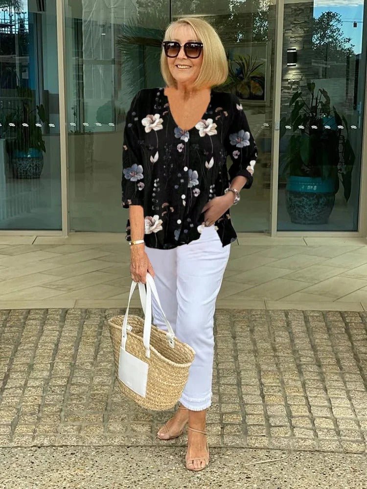 Women’s plus size floral blouse with a v-neck and relaxed fit, suitable for office outfits, casual wear, and everyday styling.