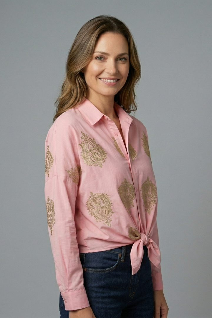 Women’s printed blouse with open neckline, button front, and long sleeves, ideal for office outfits and casual everyday styling.
