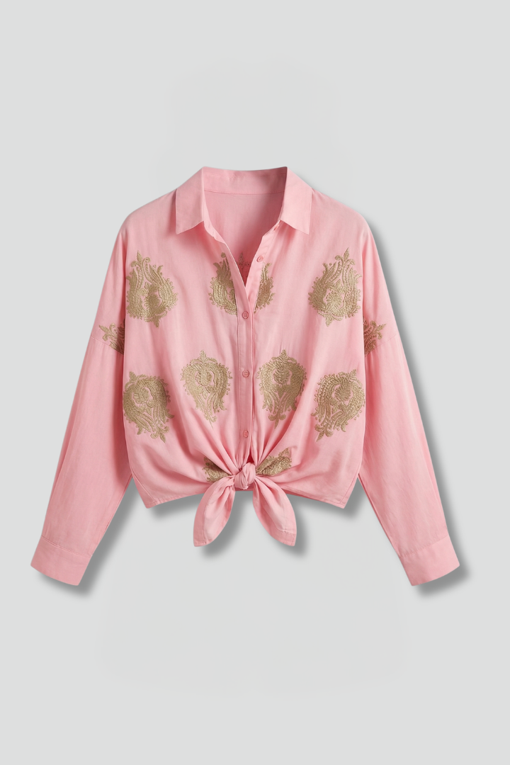 Women’s printed blouse with open neckline, button front, and long sleeves, ideal for office outfits and casual everyday styling.