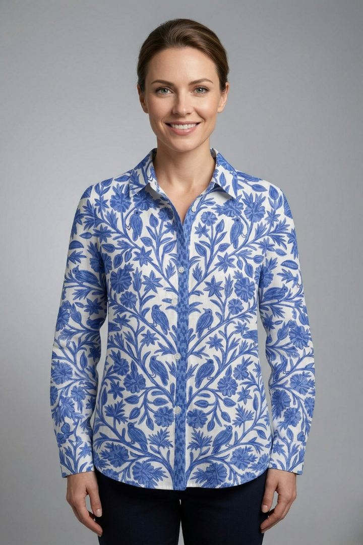 Women’s printed blouse with button front, long sleeves, and floral bird pattern, ideal for casual and smart everyday styling.