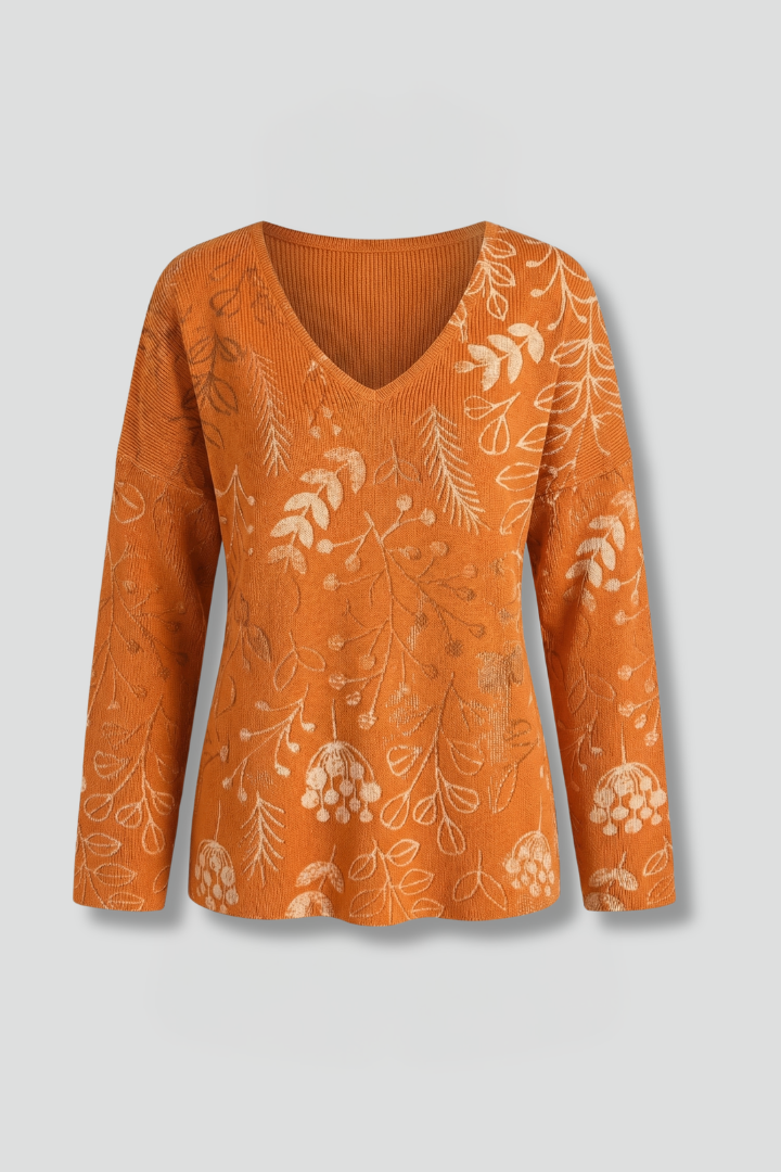 Women’s printed top with V-neckline, long sleeves, and relaxed fit, ideal for casual everyday outfits and seasonal styling.