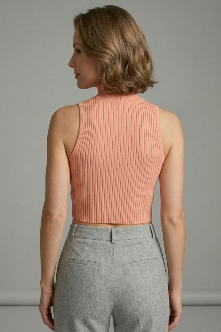 Women’s ribbed crop top with high neckline and front cut-out, ideal for casual summer outfits and evening fashion styling.