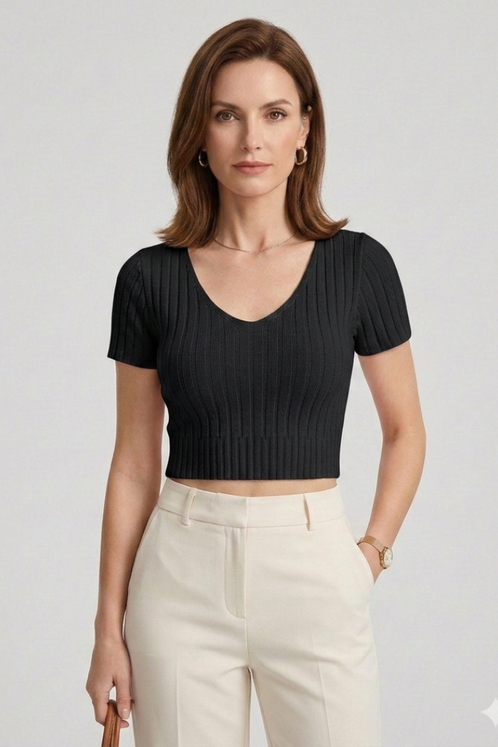 Women’s fitted ribbed crop top with short sleeves and round v-neckline, ideal for casual everyday wear and summer styling.