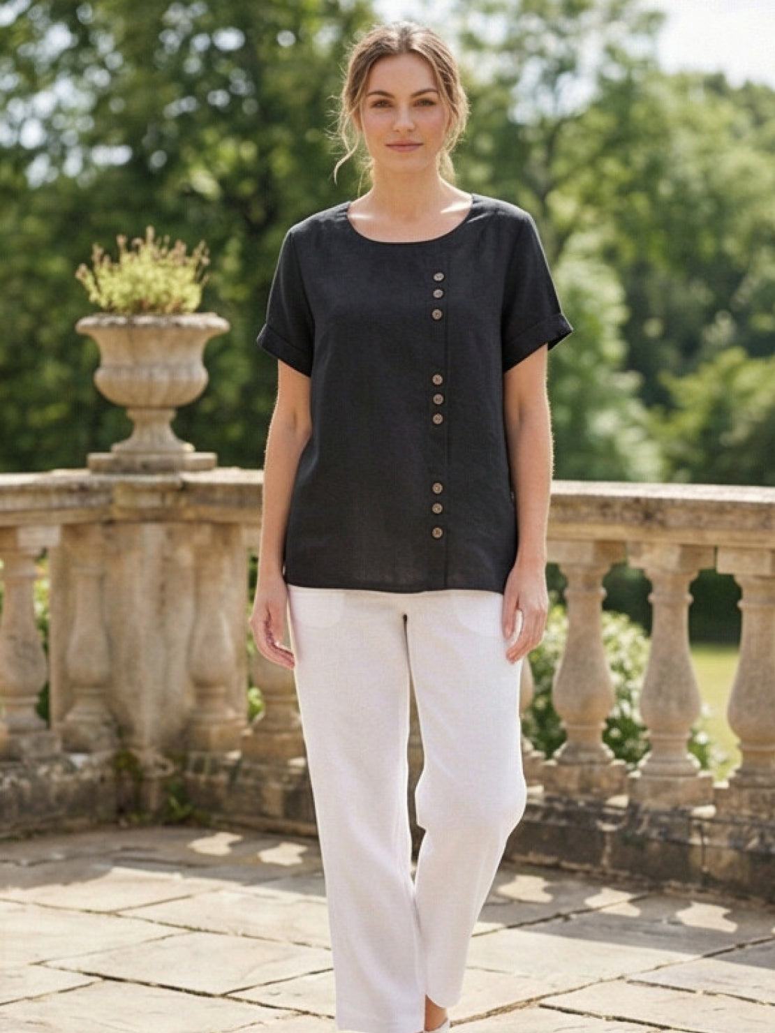 Women’s round neck blouse with button detailing and a relaxed fit, suitable for summer outfits, casual wear, and everyday styling.