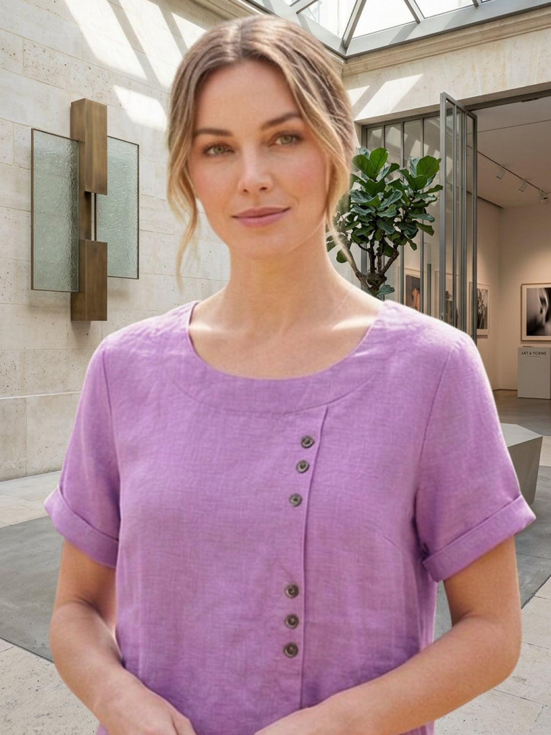Women’s round neck blouse with button detailing and a relaxed fit, suitable for summer outfits, casual wear, and everyday styling.