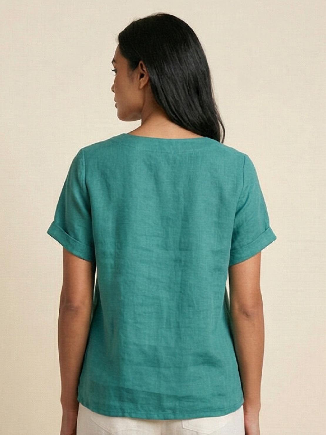 Women’s round neck blouse with button detailing and a relaxed fit, suitable for summer outfits, casual wear, and everyday styling.