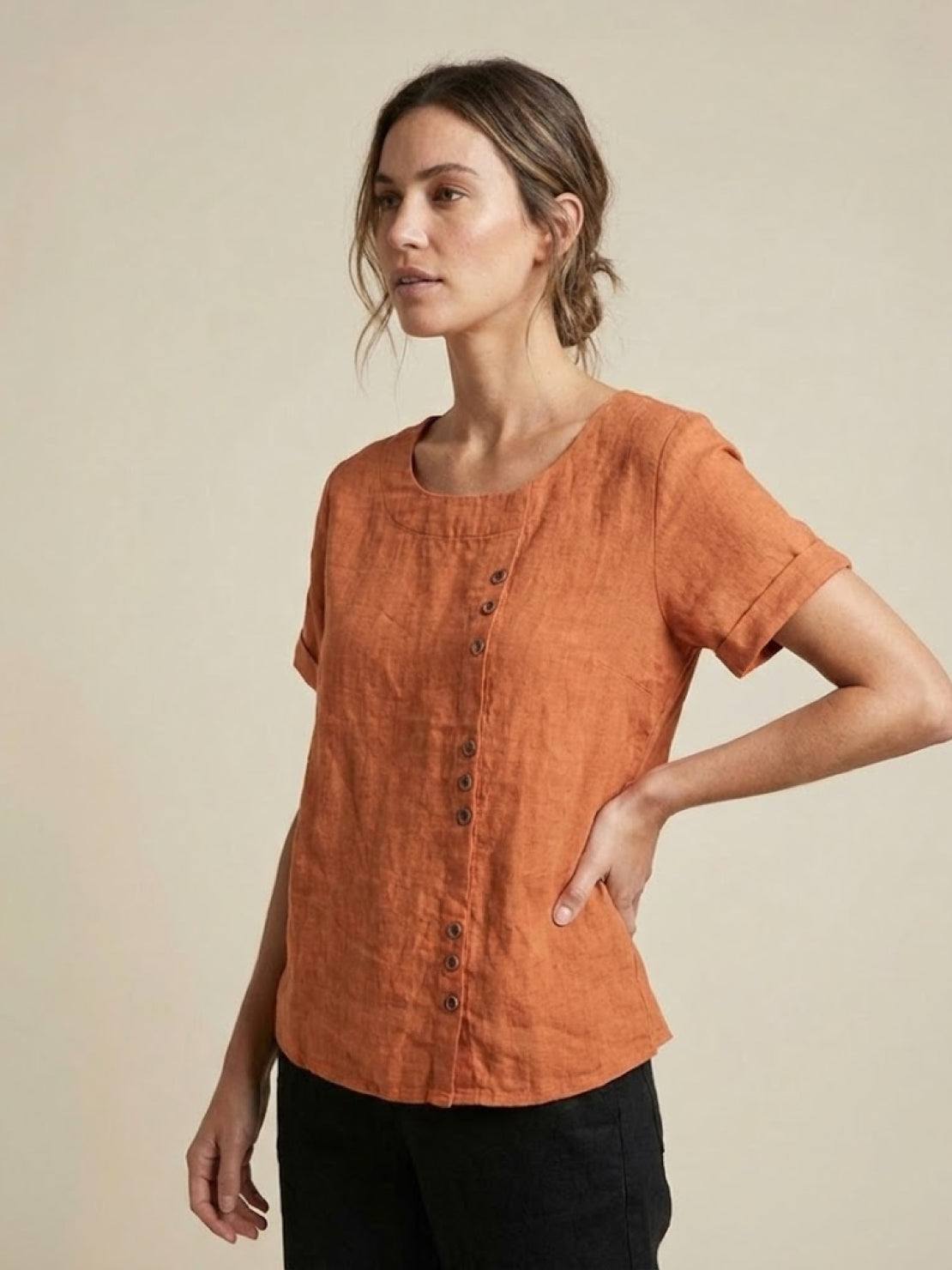 Women’s round neck blouse with button detailing and a relaxed fit, suitable for summer outfits, casual wear, and everyday styling.