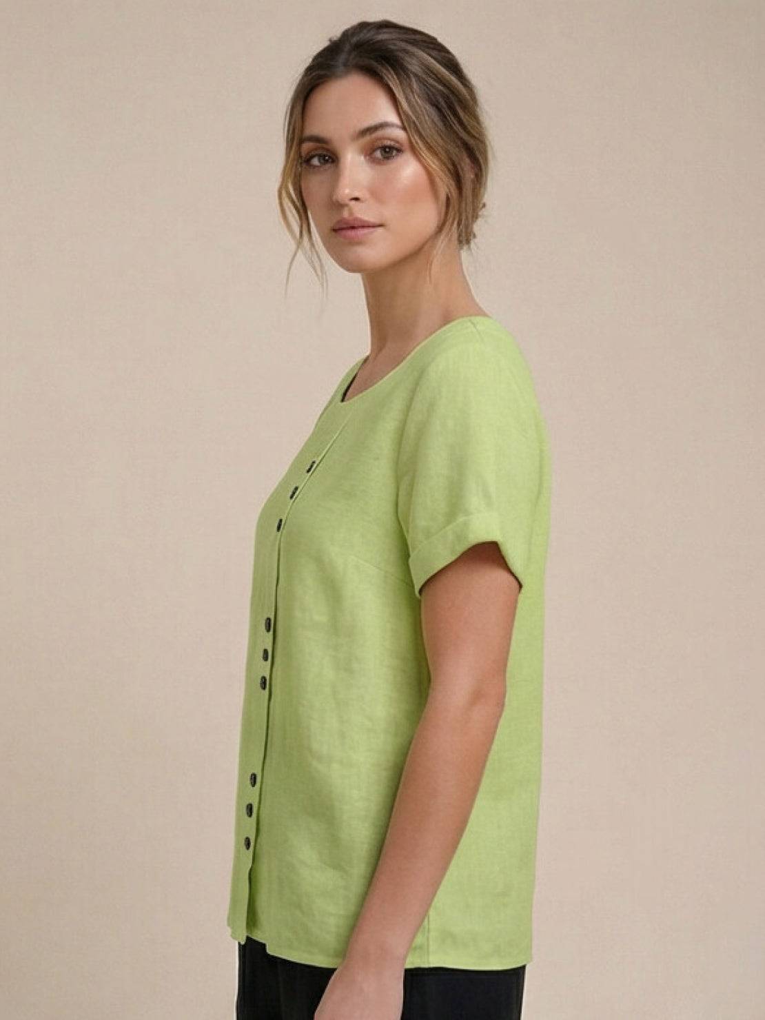 Women’s round neck blouse with button detailing and a relaxed fit, suitable for summer outfits, casual wear, and everyday styling.