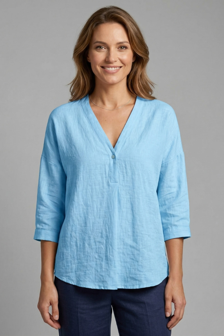 Women’s blouse with round neckline, front button closure, and long sleeves, ideal for office wear and casual everyday outfits.