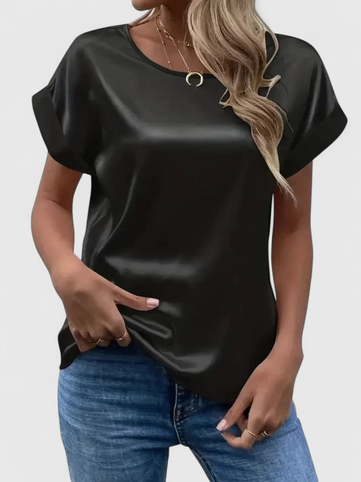 Women’s satin blouse with batwing sleeves and a relaxed fit, suitable for office outfits, casual wear, and evening styling.