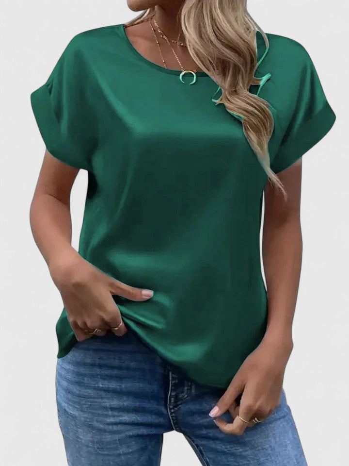 Women’s satin blouse with batwing sleeves and a relaxed fit, suitable for office outfits, casual wear, and evening styling.