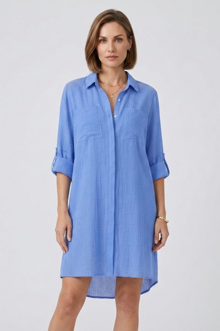 Women’s sheer cover up with button front, pointed collar, and roll-up sleeves, ideal for beachwear and vacation styling.