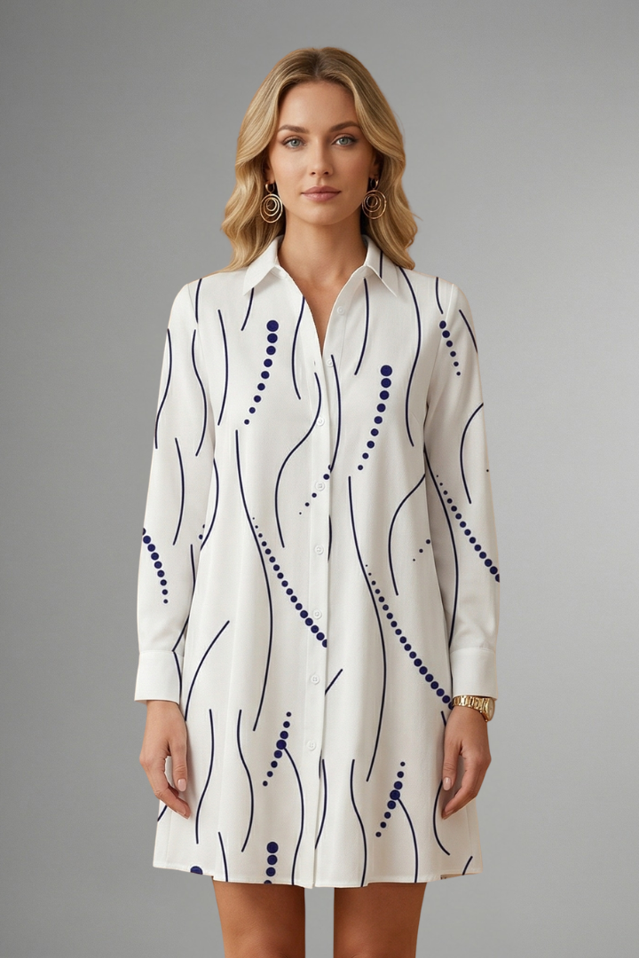 Women’s shirt dress with lapel collar, button-front closure, long sleeves, and wavy patterned surface for casual everyday styling.