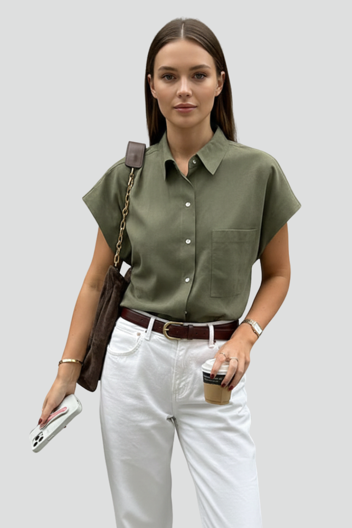 Women’s short sleeve shirt with pointed collar, button front, chest pocket, and straight hem for casual everyday styling.