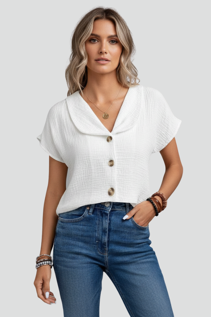 Women’s short sleeve blouse with wide collar and button front, featuring a textured surface for everyday and work outfits