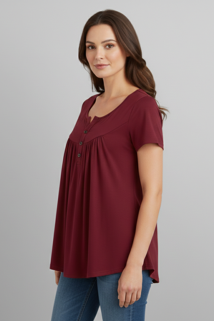 Women’s short sleeve blouse with V-neckline and front button detail, featuring a flared hem and clean finish for everyday wear and office styling.