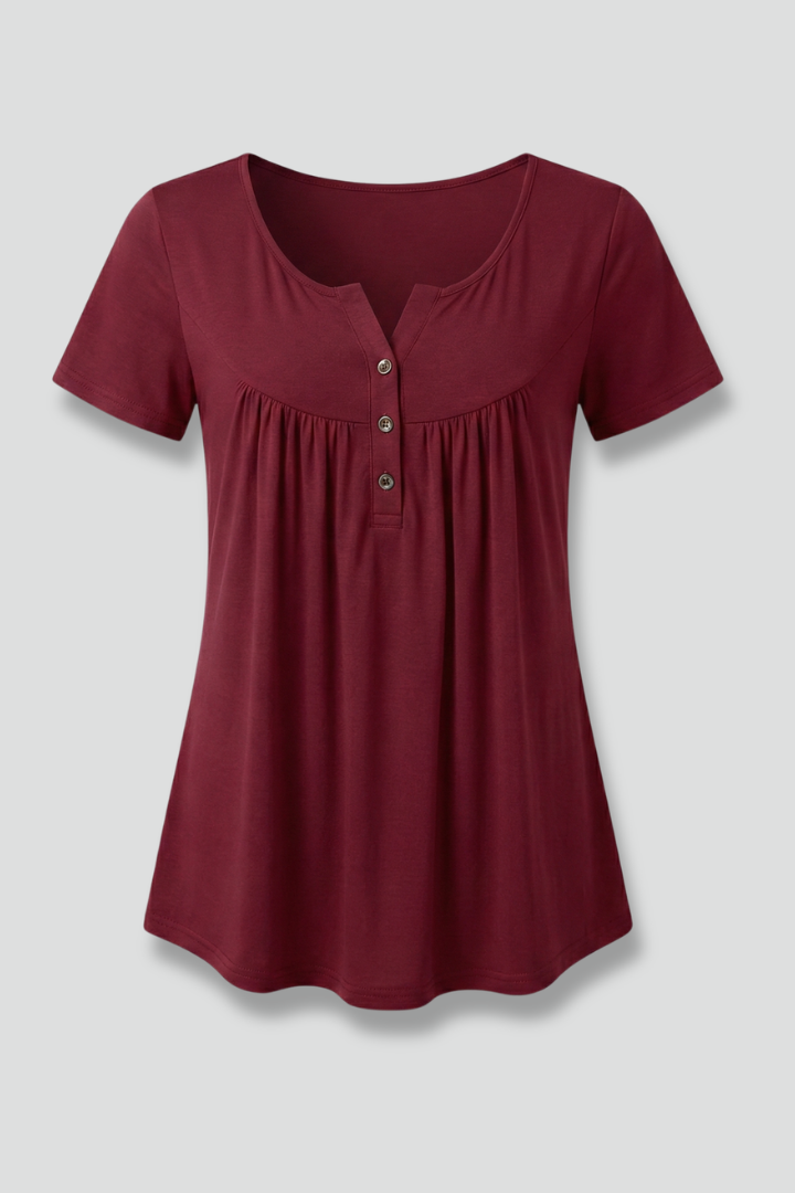 Women’s short sleeve blouse with V-neckline and front button detail, featuring a flared hem and clean finish for everyday wear and office styling.