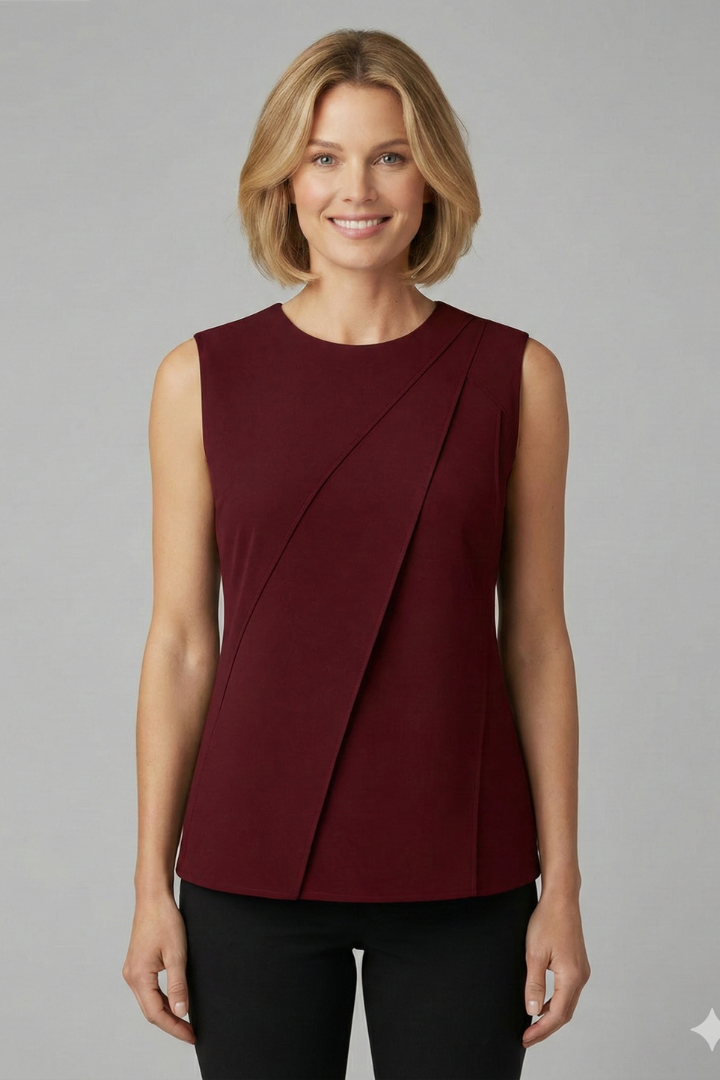 Women’s sleeveless blouse with round neckline and clean finish, featuring a straight hem and wide shoulder coverage for everyday wear.