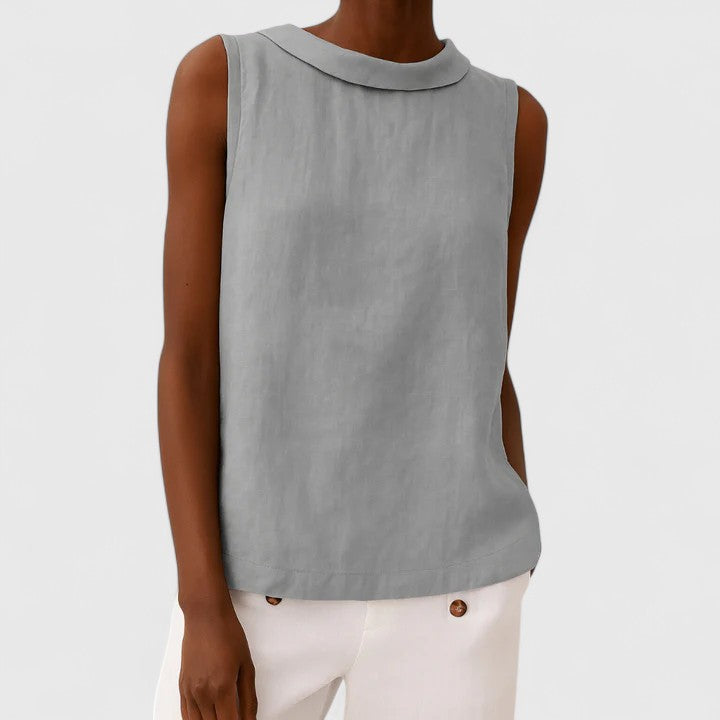 Women’s sleeveless top with a roll collar, draped neckline, and relaxed fit, ideal for office wear, evening outings, and smart-casual styling.
