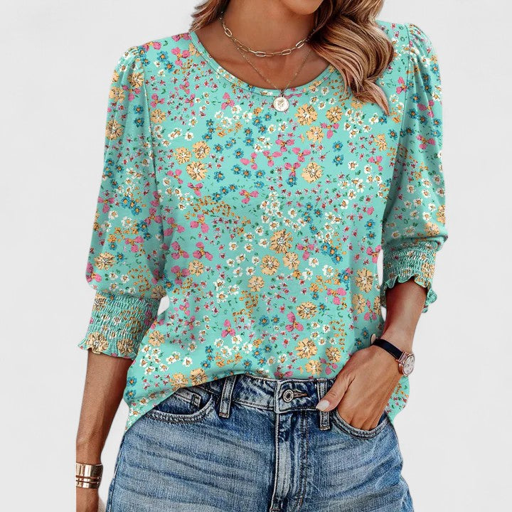 Women’s smocked top with a relaxed fit and lightweight design, ideal for casual outings, vacations, and everyday styling.