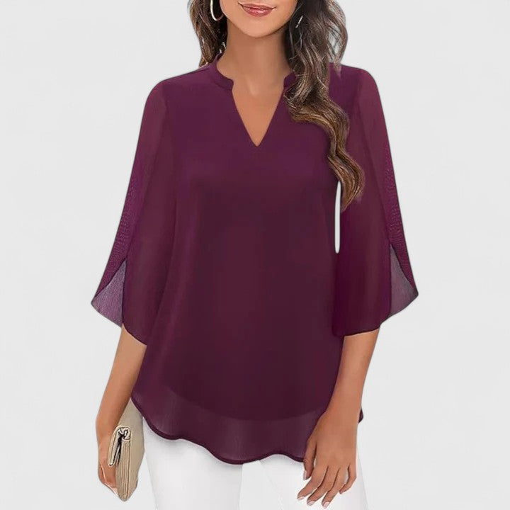 Women’s sophisticated blouse with relaxed fit and elegant silhouette, ideal for office wear, dinners, and casual everyday styling.