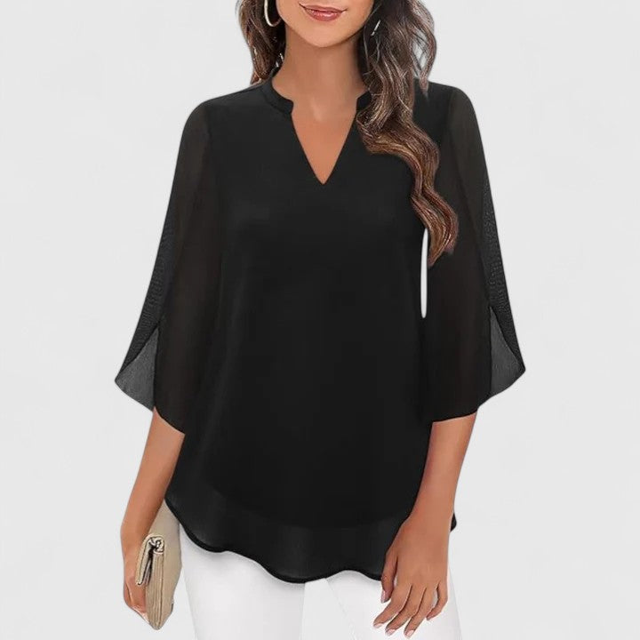 Women’s sophisticated blouse with relaxed fit and elegant silhouette, ideal for office wear, dinners, and casual everyday styling.