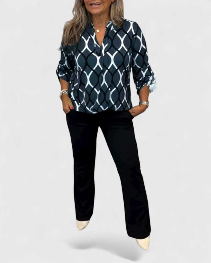 Women’s sophisticated blouse with elegant detailing and a relaxed fit, suitable for office outfits, casual wear, and smart occasions.